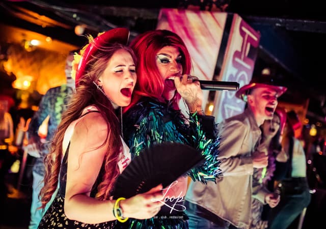 Guest and performer singing Guest and performer singing
